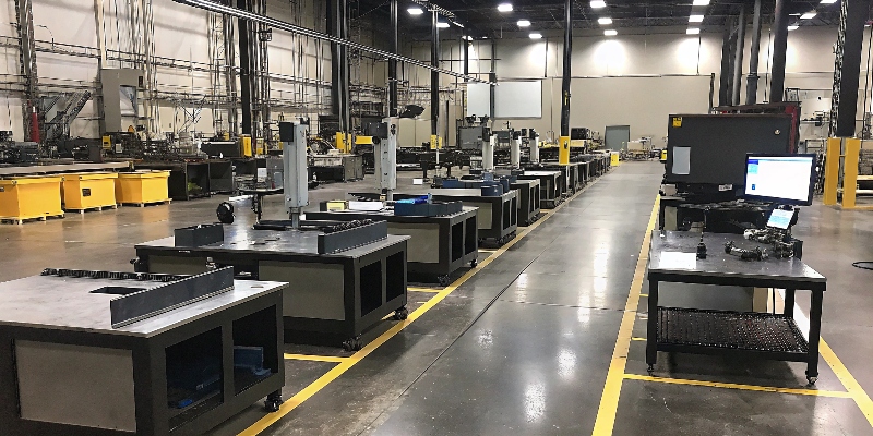 A quality lab with various inspection equipment like a CMM, 3D scanner, and X-ray machine.