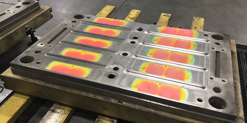 A thermal camera image showing the temperature distribution across a die casting mold.