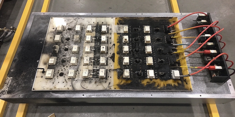 A damaged motor controller circuit board with burn marks