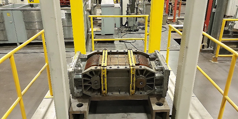 A futuristic concept image of an EV motor with a cutaway showing its intricate die-cast housing and integrated cooling channels
