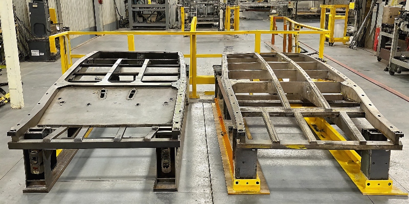 A side-by-side comparison of a heavy steel automotive subframe and a much lighter die-cast aluminum version