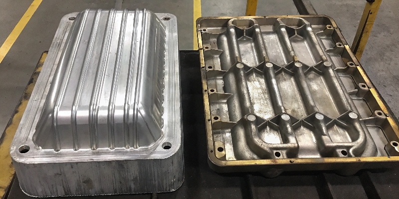 A side-by-side comparison of a soft, pure aluminum ingot and a complex, strong die-cast aluminum part