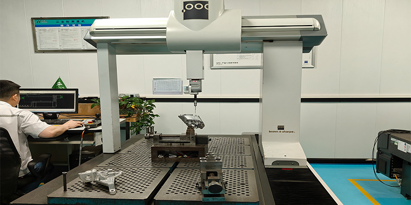Key Considerations for Achieving Precision A quality technician carefully measures a machined aluminum part on a Coordinate Measuring Machine (CMM).