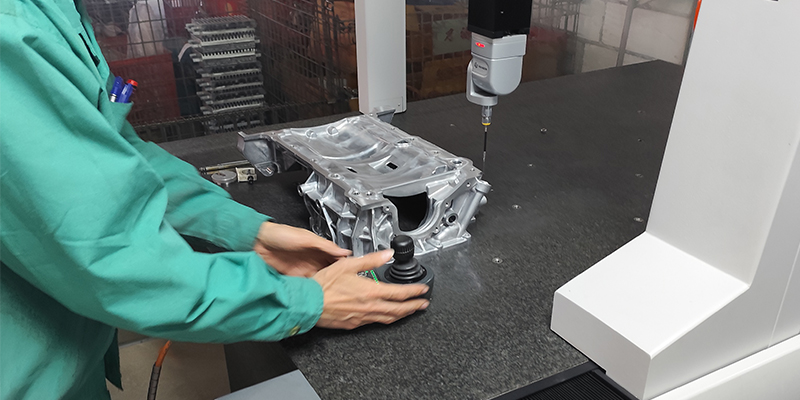 A conceptual image of EMP Tech's R&D lab with diverse specialists (engineers, metallurgists) collaborating on advanced die-cast component designs for EVs.